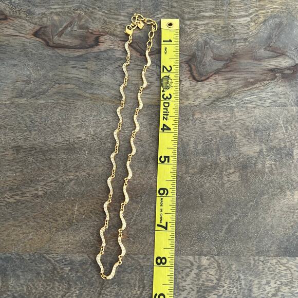 Signed Swarovski Crystal Elegant Gold Tone Wave Necklace missing one small stone - Picture 5 of 7